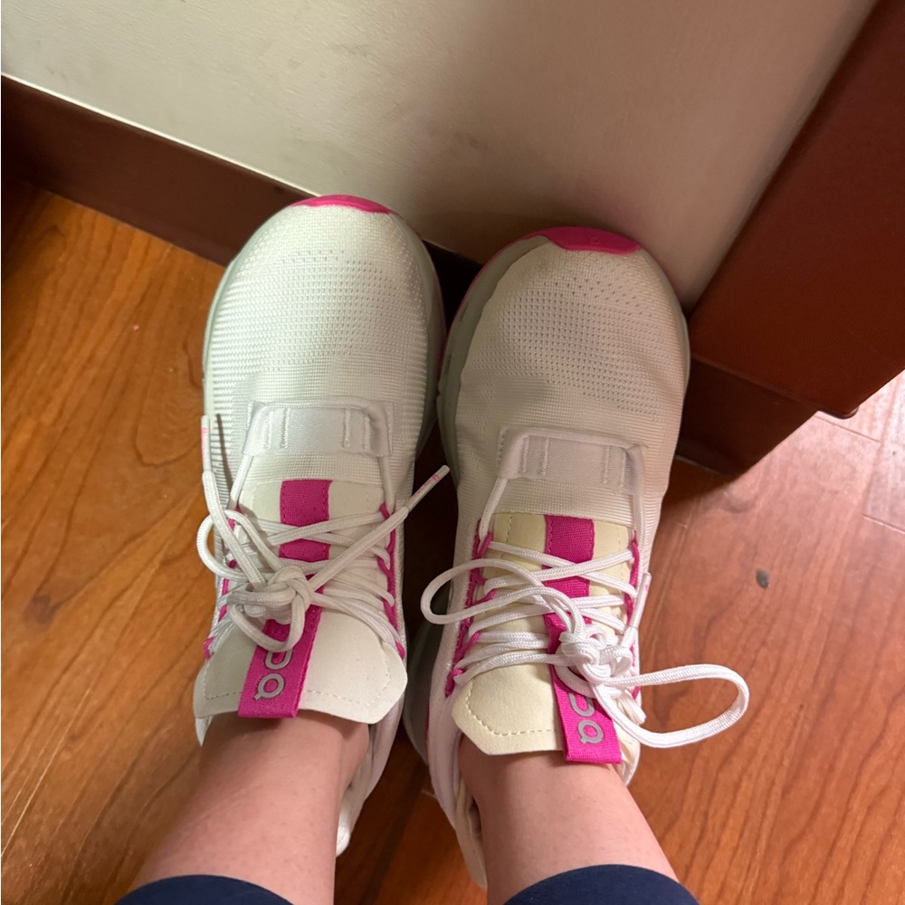 On Running White and Pink Sneakers with Smooth Upper